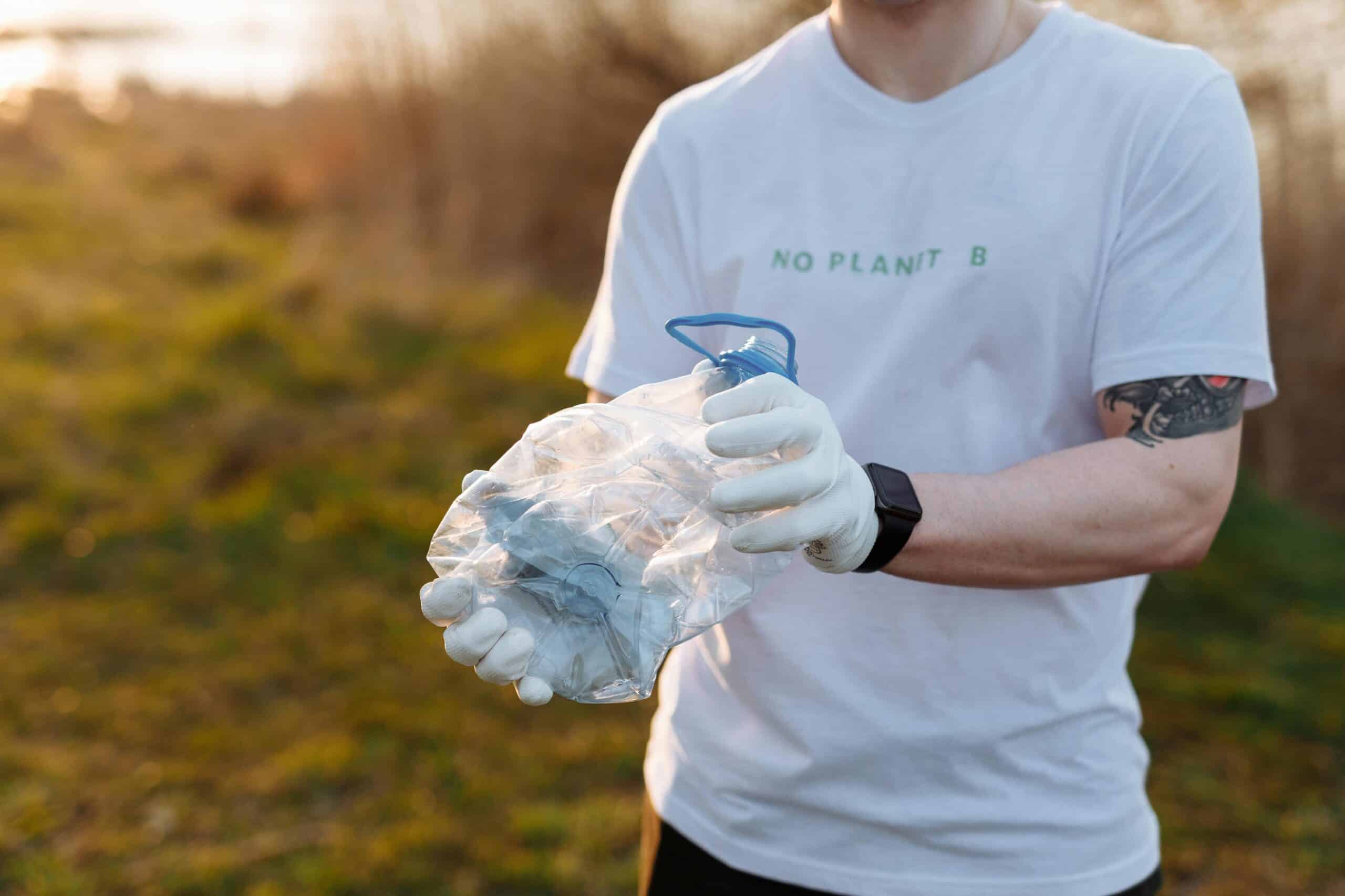 man holding plastic waste in his hand